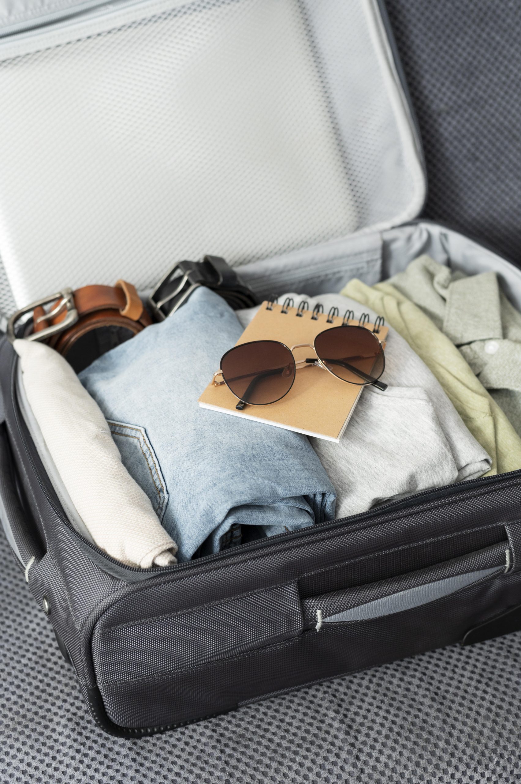 arrangement clothes accessories suitcase