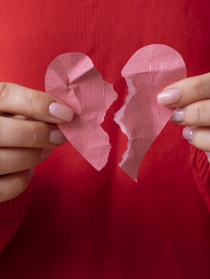 person holding broken heart